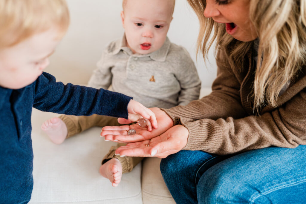 mom and children playing together during their in-home family photoshoot in Minneapolis, MN