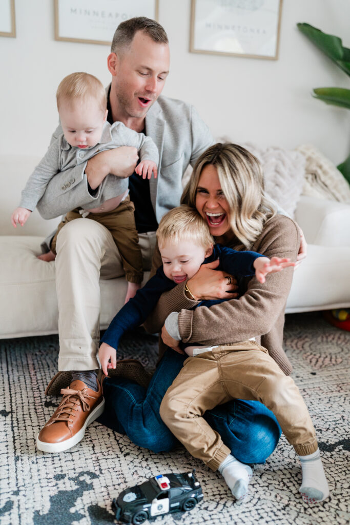 authentic Minneapolis family snuggled together for their in-home lifestyle family session.